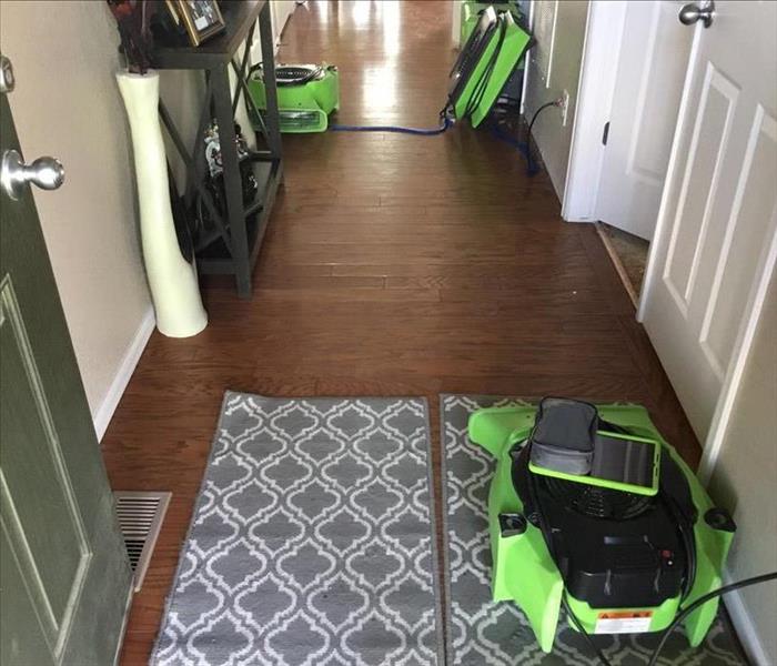 Water damage in the hallway from heavy rains