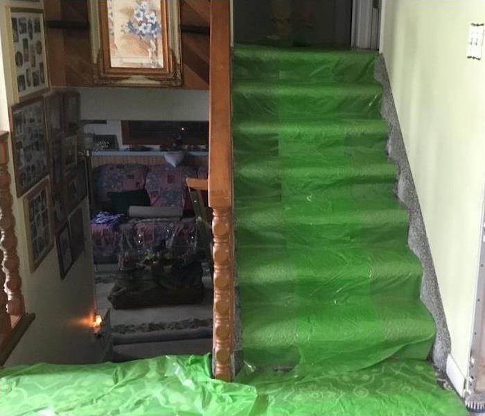 carpet protection on stairs in home with water damage 