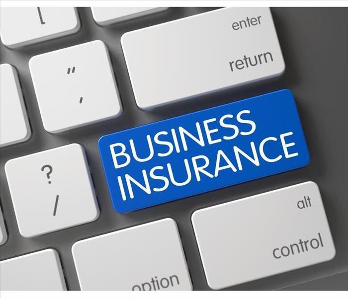 Concept of Business Insurance, with Business Insurance on Blue Enter Button on Modernized Keyboard.