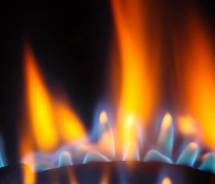 Flames coming out from a gas burner