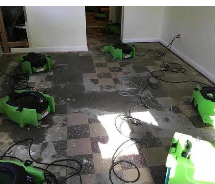 Air movers placed on floor after flooding from storm