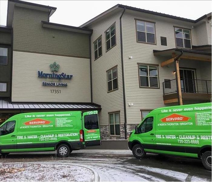 SERVPRO vans in front of a hotel with snow on the ground
