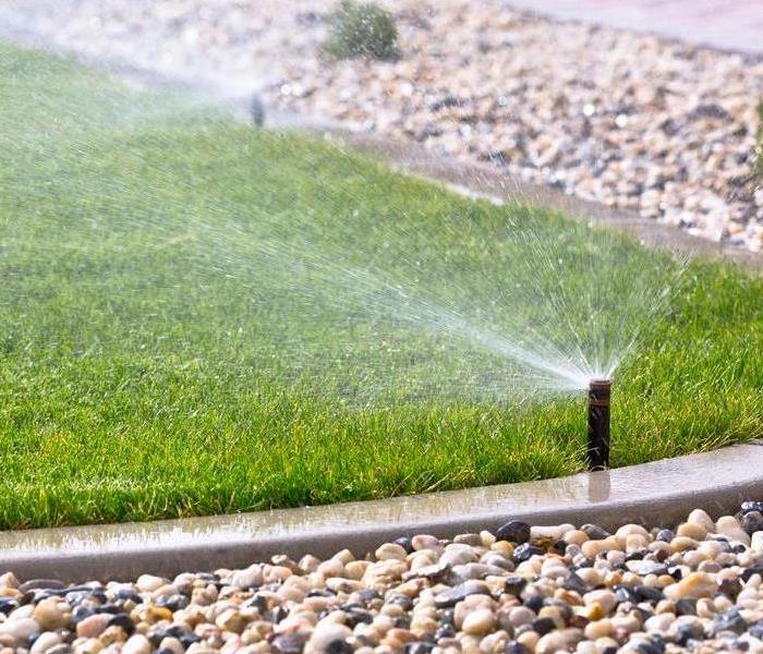 a sprinkler with water coming out